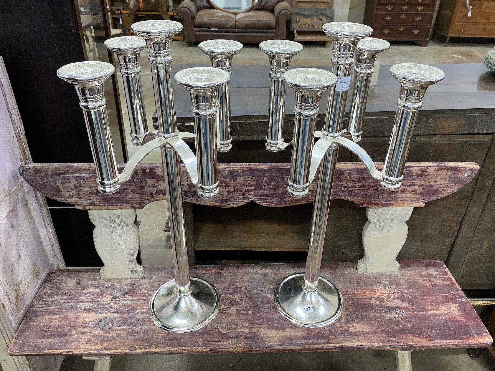 A pair of Meuker five branch chrome plated candlesticks, height 85cm